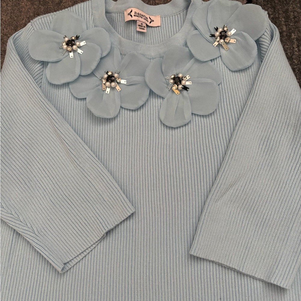 Blue Sweater with Floral Embellishments